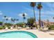 Serene pool area featuring comfortable lounge chairs and umbrellas surrounded by lush landscaping and tall palm trees at 7115 E Buena Terra Way, Paradise Valley, AZ 85253