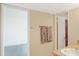 A bathroom with a sink and towels in view with an open door at 7350 N Via Paseo Del Sur -- # N207, Scottsdale, AZ 85258