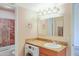 A clean bathroom with a washing machine under the sink and a shower at 7350 N Via Paseo Del Sur -- # N207, Scottsdale, AZ 85258