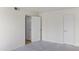 A cozy bedroom with 2 doors and neutral colored carpet at 7350 N Via Paseo Del Sur -- # N207, Scottsdale, AZ 85258