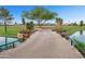 Picturesque golf course view with a bridge, tranquil water, and views of distant mountains at 7350 N Via Paseo Del Sur -- # N207, Scottsdale, AZ 85258