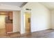 Spacious living area featuring wood floors and seamless transition into the adjacent kitchen at 7350 N Via Paseo Del Sur -- # N207, Scottsdale, AZ 85258