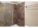 A modern shower with granite walls and a shower head and faucet at 7350 N Via Paseo Del Sur -- # N207, Scottsdale, AZ 85258