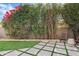 Secluded backyard featuring a patio area, artificial turf, and lush landscaping at 7409 E Pleasant Run, Scottsdale, AZ 85258