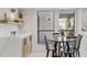 Cozy breakfast nook with natural light, modern table setting, and views of the outdoor area at 7409 E Pleasant Run, Scottsdale, AZ 85258