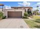 Beautiful two-story home with a large garage and mature landscaping at 7409 E Pleasant Run, Scottsdale, AZ 85258