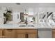 Open-concept kitchen showcases modern appliances, a spacious island, and a seamless connection to the living area at 7409 E Pleasant Run, Scottsdale, AZ 85258
