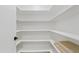 Bright pantry with white walls and shelving offers ample storage space for an organized kitchen at 7409 E Pleasant Run, Scottsdale, AZ 85258