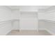 Spacious walk-in closet with ample storage, built-in shelving, and well-organized hanging space at 7409 E Pleasant Run, Scottsdale, AZ 85258