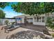 Inviting backyard with brick patio, mature trees and sun loungers at 7632 E Bonita Dr, Scottsdale, AZ 85250