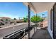 The outdoor balcony featuring wrought iron design and views of the sunny neighborhood at 7632 E Bonita Dr, Scottsdale, AZ 85250