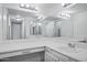 Bathroom featuring a large mirror, bright lighting, vanity, vessel sink, and updated fixtures at 7632 E Bonita Dr, Scottsdale, AZ 85250