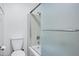 Clean bathroom featuring a tub and shower combination, toilet, and updated fixtures throughout the space at 7632 E Bonita Dr, Scottsdale, AZ 85250