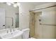 Bright bathroom featuring a vessel sink, walk-in shower, modern fixtures, and hand rails for convenience at 7632 E Bonita Dr, Scottsdale, AZ 85250