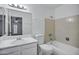 Bright bathroom featuring a bathtub, shower, sink and an oversized mirror at 7632 E Bonita Dr, Scottsdale, AZ 85250
