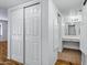 Bathroom with large closet doors leading to a vanity with mirrors, drawers, and cabinet space at 7632 E Bonita Dr, Scottsdale, AZ 85250