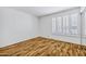 Bright bedroom with hard wood floors and large shuttered window at 7632 E Bonita Dr, Scottsdale, AZ 85250