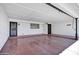 Spacious carport with two doors, tile flooring, and ample lighting, ready for vehicles and storage at 7632 E Bonita Dr, Scottsdale, AZ 85250
