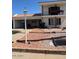 Charming two-story home with a balcony, low-maintenance landscaping, and convenient covered parking at 7632 E Bonita Dr, Scottsdale, AZ 85250