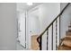 Upstairs hallway with wood floors, a view of the stairs, and doorways to rooms at 7632 E Bonita Dr, Scottsdale, AZ 85250