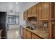 Kitchen area with granite countertops, stainless steel appliances, and tile flooring at 7632 E Bonita Dr, Scottsdale, AZ 85250