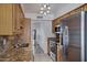 Kitchen showcases stainless steel appliances, granite countertops, and lots of storage at 7632 E Bonita Dr, Scottsdale, AZ 85250