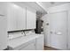 Laundry room featuring modern washer, dryer, and plenty of storage space at 7632 E Bonita Dr, Scottsdale, AZ 85250