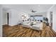Bright living room boasts modern furnishings, wood flooring and a ceiling fan at 7632 E Bonita Dr, Scottsdale, AZ 85250