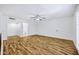 Spacious living room featuring wood floors, a ceiling fan, and bright natural light at 7632 E Bonita Dr, Scottsdale, AZ 85250
