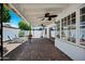 Covered patio with brick flooring, two ceiling fans, and outdoor furniture at 7632 E Bonita Dr, Scottsdale, AZ 85250