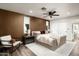 Modern bedroom features a ceiling fan, decorative pillows, and a comfortable seating area at 8341 E Hubbell St, Scottsdale, AZ 85257