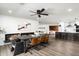 Open-concept dining area with a modern fireplace, stylish table, and seamless flow to the kitchen at 8341 E Hubbell St, Scottsdale, AZ 85257