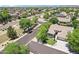 A high angle view of a suburban street showing nearby houses and well-manicured landscaping at 8664 W Yukon Dr, Peoria, AZ 85382
