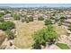 Expansive green space with mature trees and landscaping in a tranquil neighborhood setting, with mountain views at 8664 W Yukon Dr, Peoria, AZ 85382