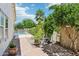 The backyard features a glimpse of the pool area, greenery, and desert landscaping at 8664 W Yukon Dr, Peoria, AZ 85382