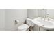 Well-maintained bathroom featuring a toilet, sink, and vanity with gold fixtures at 8664 W Yukon Dr, Peoria, AZ 85382