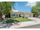 Charming single-story home showcasing a well-manicured lawn and a three-car garage at 8664 W Yukon Dr, Peoria, AZ 85382