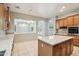 Open concept kitchen featuring an island, stainless appliances, and breakfast bar at 8664 W Yukon Dr, Peoria, AZ 85382
