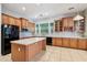 A spacious kitchen with stainless steel appliances, granite countertops, and a central island at 8664 W Yukon Dr, Peoria, AZ 85382
