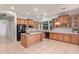 Open concept kitchen with an island, plenty of cabinets, and modern appliances at 8664 W Yukon Dr, Peoria, AZ 85382