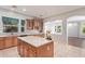 Stylish kitchen with a large island, granite countertops, and stainless steel appliances at 8664 W Yukon Dr, Peoria, AZ 85382