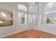 Bright living room with hardwood floors, clerestory windows and gray paint at 8664 W Yukon Dr, Peoria, AZ 85382