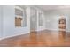Open-concept living room featuring hardwood floors and soft gray walls at 8664 W Yukon Dr, Peoria, AZ 85382