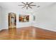 Hardwood floors highlight this spacious living room open to the eat-in kitchen at 8664 W Yukon Dr, Peoria, AZ 85382