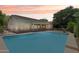 Backyard view showcasing the pool area with a safety fence around the perimeter at 8664 W Yukon Dr, Peoria, AZ 85382