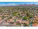 An expansive desert community with lush landscaping, pools, and tile roofs backing up to picturesque mountains at 10157 E San Salvador Dr, Scottsdale, AZ 85258