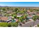 Scenic aerial view of a residential community featuring lush landscaping, swimming pools, and well-maintained homes at 10157 E San Salvador Dr, Scottsdale, AZ 85258