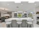 Bright, open kitchen featuring a large island with seating, stainless steel appliances, and abundant natural light at 10157 E San Salvador Dr, Scottsdale, AZ 85258