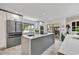 Modern kitchen featuring stainless steel appliances, ample counter space, and a seamless transition to the outdoor patio at 10157 E San Salvador Dr, Scottsdale, AZ 85258