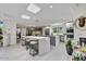 Spacious kitchen with stainless steel appliances, a large center island with seating, and ample counter space at 10157 E San Salvador Dr, Scottsdale, AZ 85258